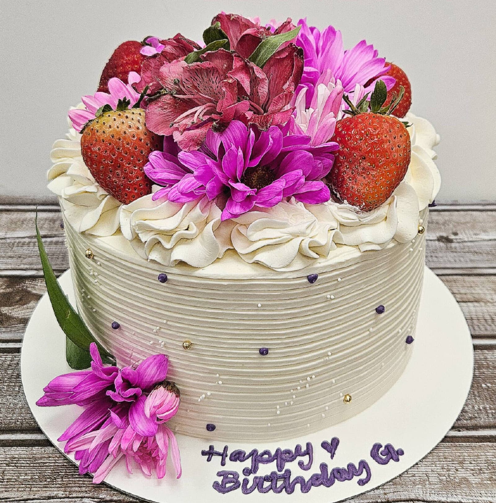 Custom cake with flowers and strawberries